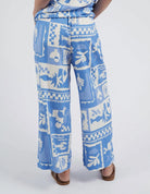 Add a pop of style to your wardrobe with the Postcard Print Holiday Sun Pants.