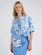 A woman modelling the Holiday Sun Shirt With Prints in Cerulean Holiday Design by Elm