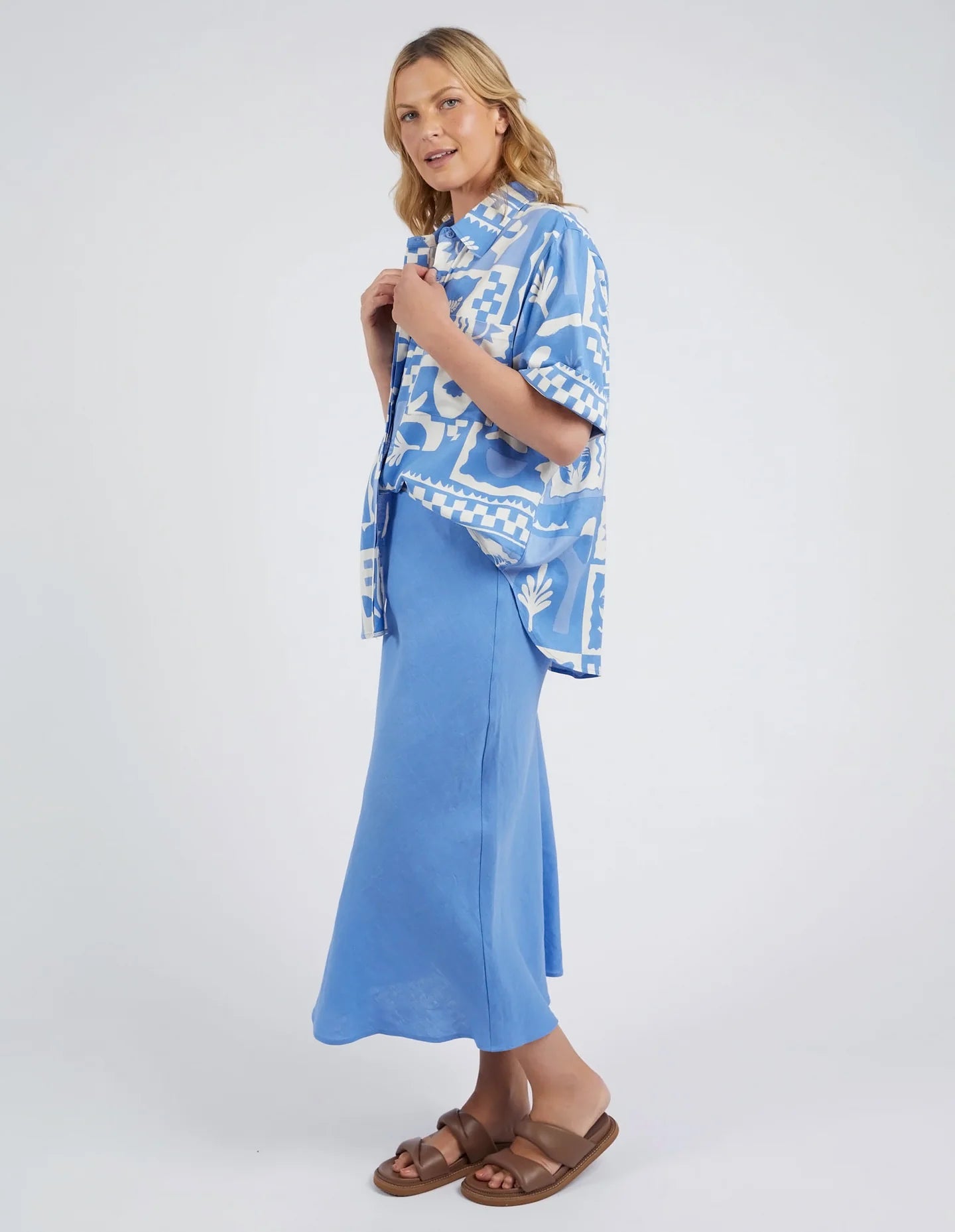 A woman modelling the Holiday Sun Shirt With Prints in Cerulean Holiday Design by Elm