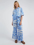 Add a pop of style to your wardrobe with the Postcard Print Holiday Sun Pants.