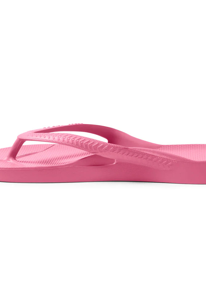 hot pink arch support thongs with contoured footbeds and ergonomic straps for enhanced comfort and stability.