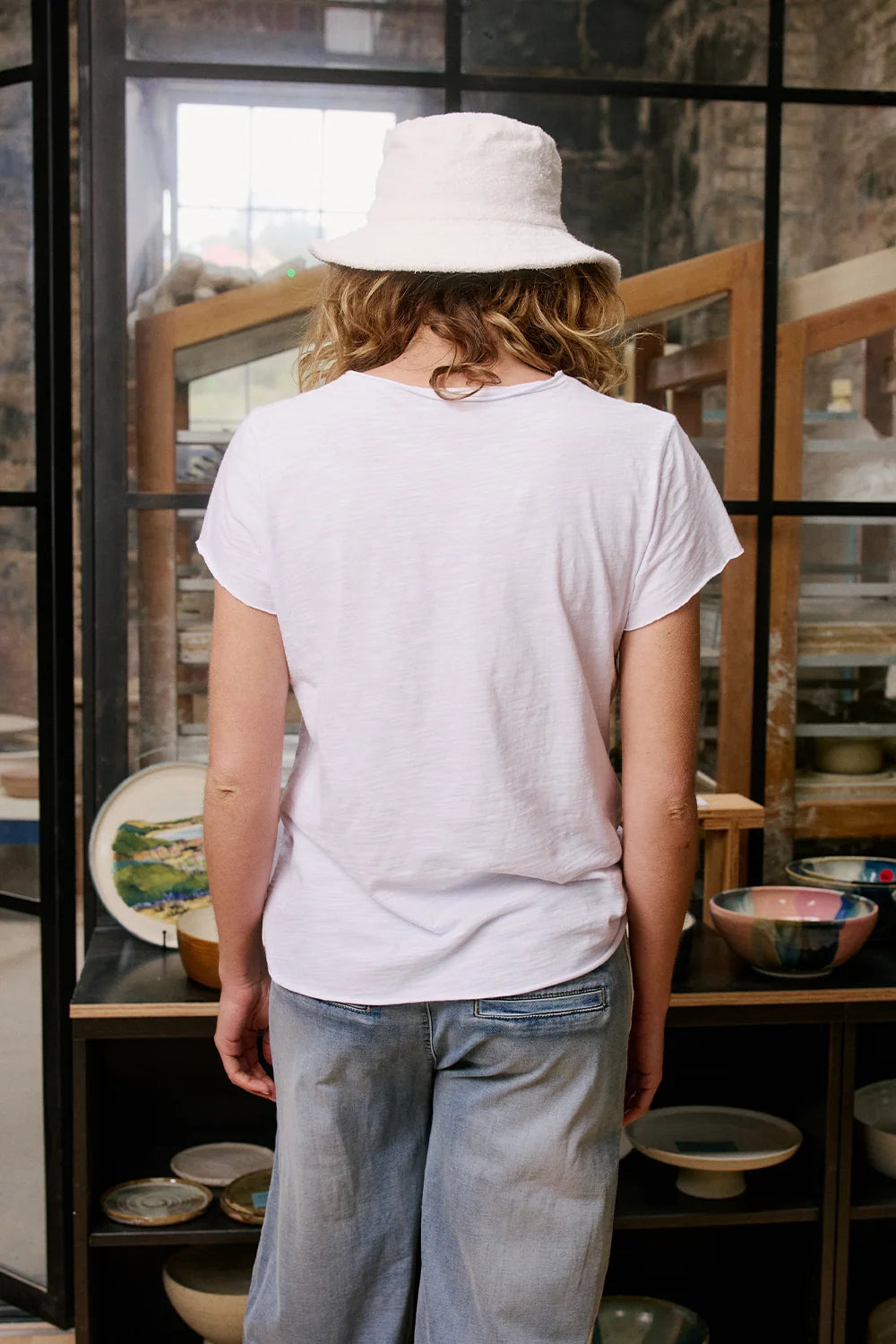Ice Tee in white marle featuring a signature star print, relaxed fit, crew neckline, short sleeves and raw-edge hem.