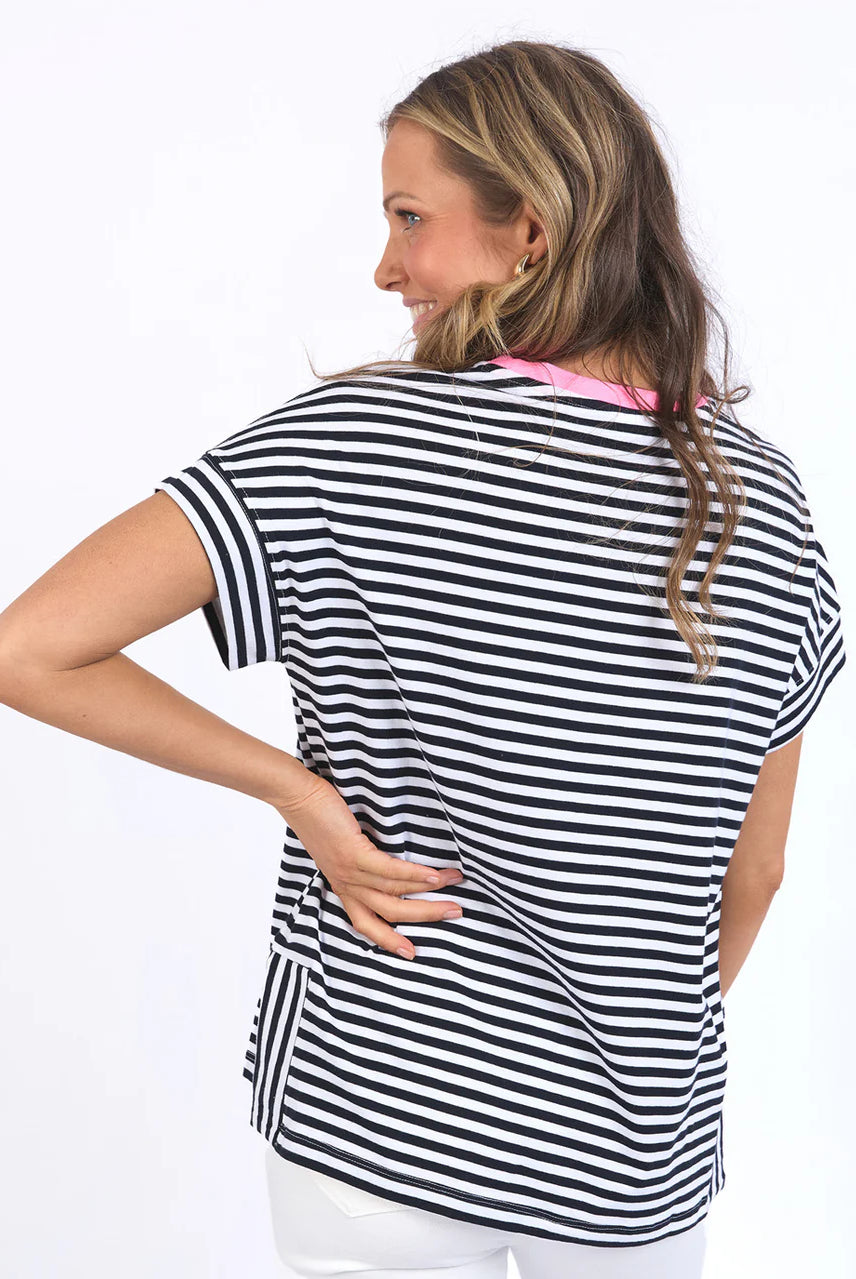 Navy and white striped Jarrah Short Sleeve Tee by Elm with a pink contrast neckline, relaxed fit, cuffed sleeves, and side splits.