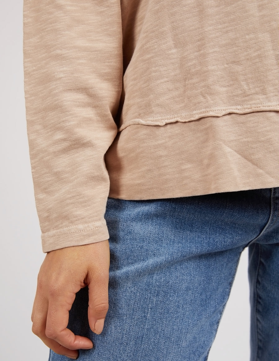Woman wearing the Jayne Throw On Top, a relaxed lightweight long sleeve perfect for everyday casual styling.