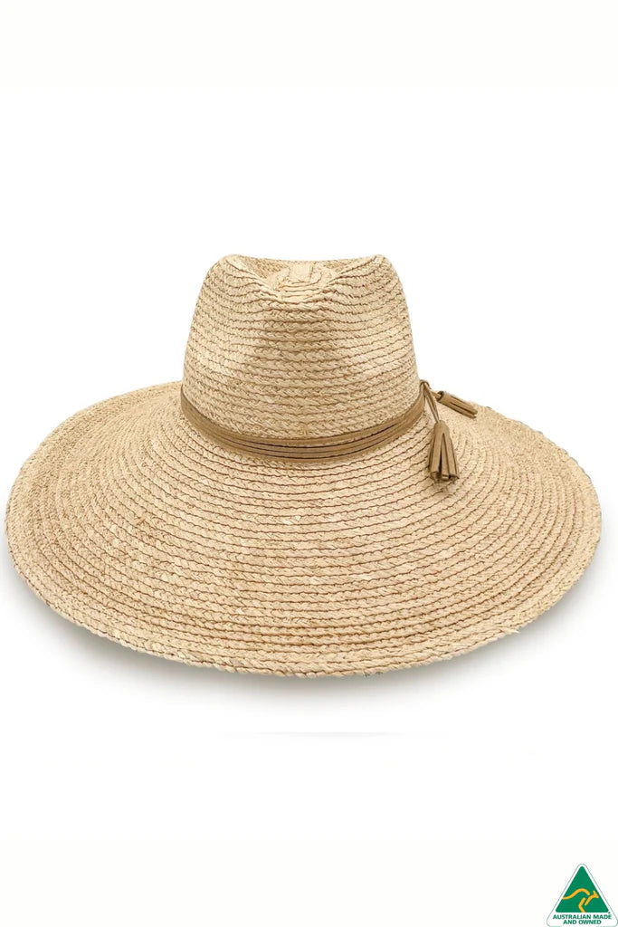 Kimberley Raffia Fedora in natural with 13cm wide brim, 10cm crown, brown leather tassel trim, ComfyFit adjustable band, and removable chin strap.