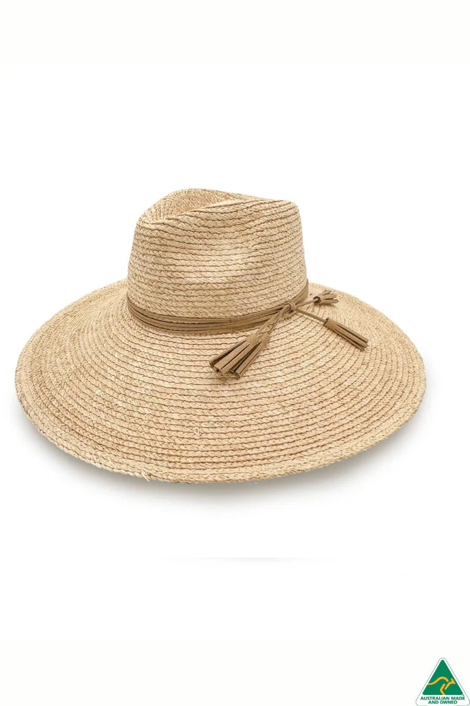 Kimberley Raffia Fedora in natural with 13cm wide brim, 10cm crown, brown leather tassel trim, ComfyFit adjustable band, and removable chin strap.