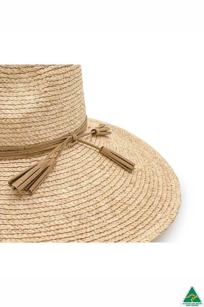 Kimberley Raffia Fedora in natural with 13cm wide brim, 10cm crown, brown leather tassel trim, ComfyFit adjustable band, and removable chin strap.