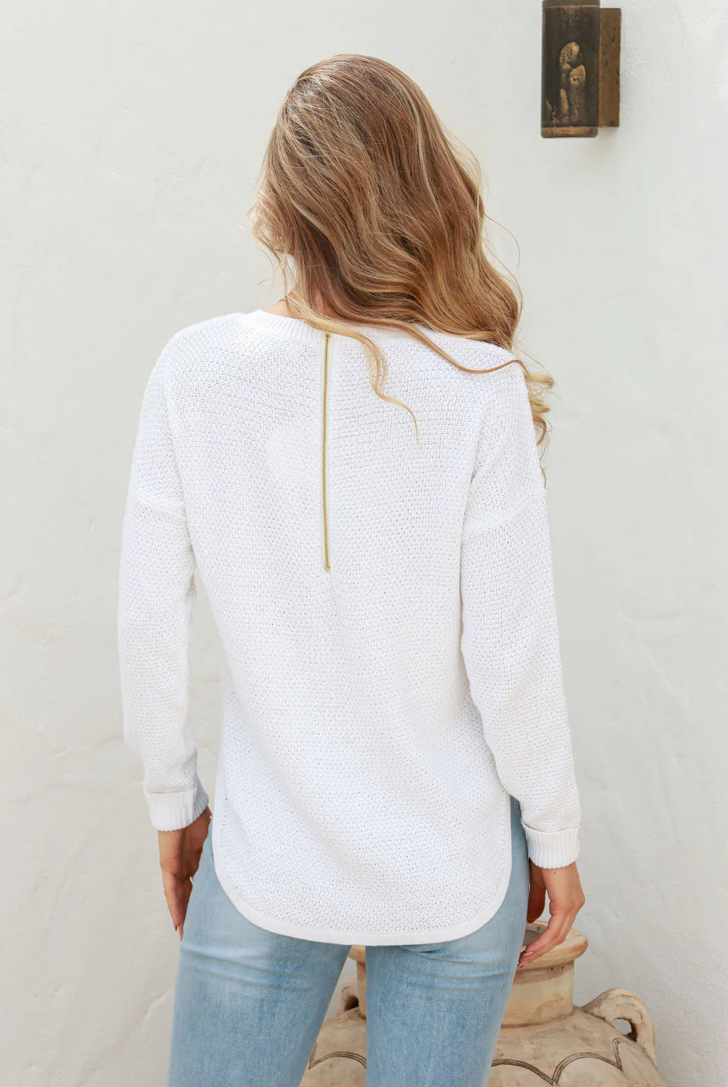 Winter White Zip Back Knit Jumper with a high scoop neckline, long sleeves with turned-up cuffs, dropped shoulders, and silver zipper detail at the back.