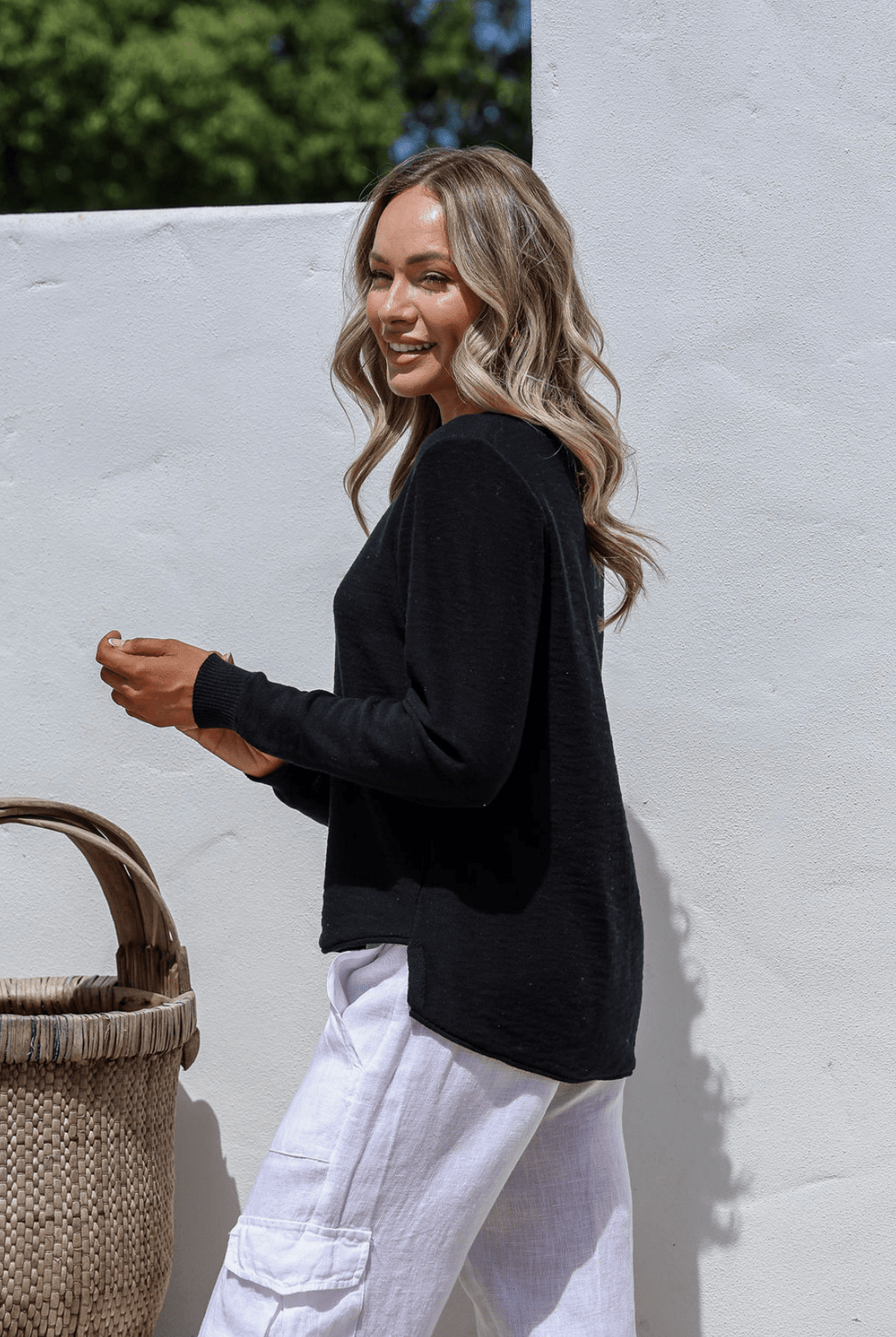 Black 100% cotton light knit top with a breathable, timeless design, ideal for layering or wearing alone for everyday comfort and style.