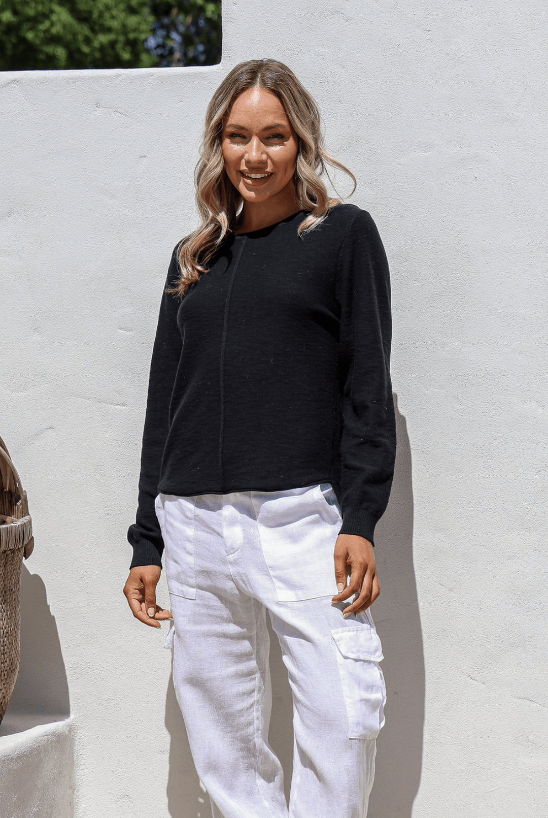 Black 100% cotton light knit top with a breathable, timeless design, ideal for layering or wearing alone for everyday comfort and style.