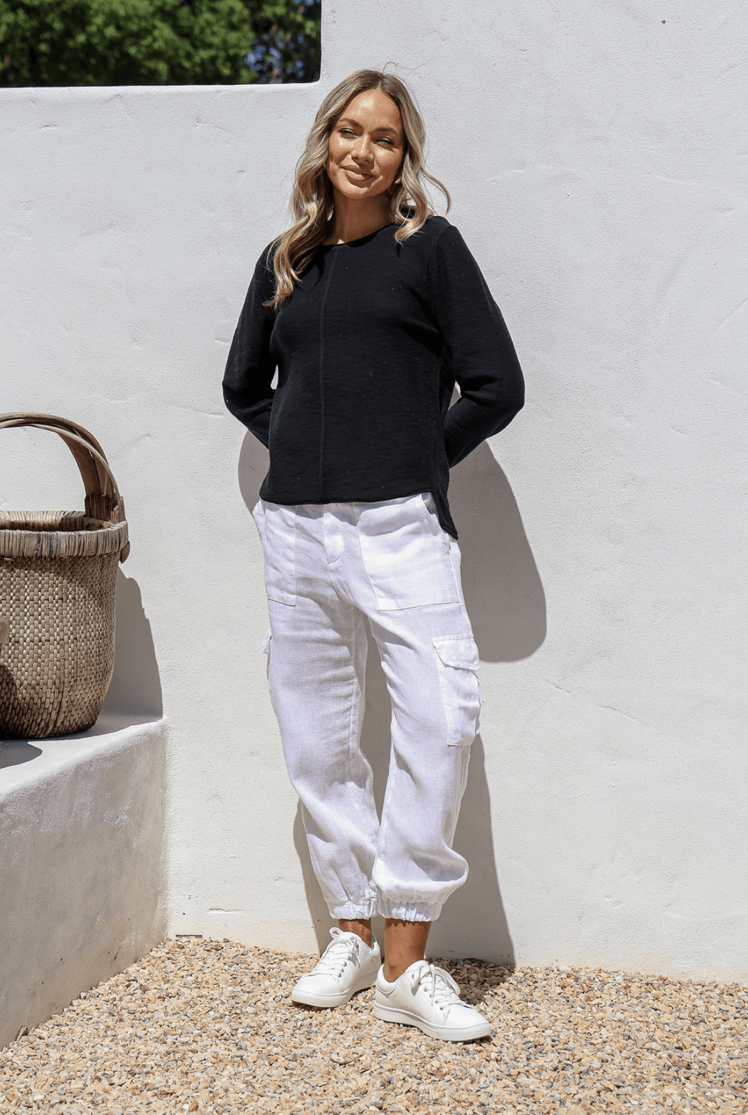 Black 100% cotton light knit top with a breathable, timeless design, ideal for layering or wearing alone for everyday comfort and style.