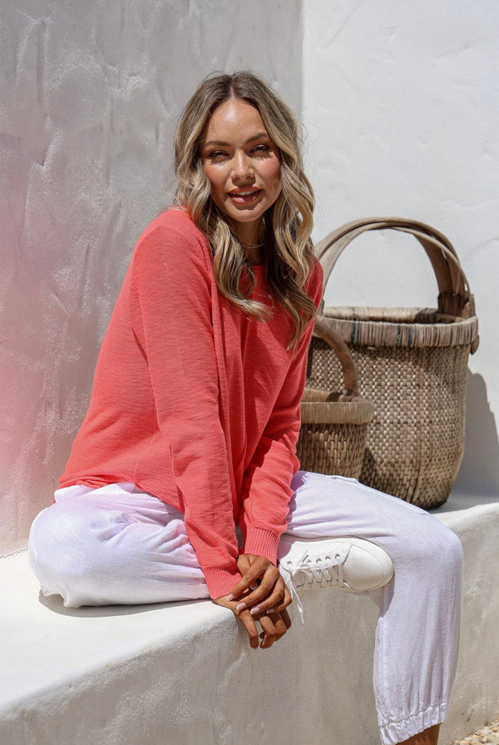 Coral 100% cotton light knit top with a breathable, timeless design, ideal for layering or wearing alone for everyday comfort and style.