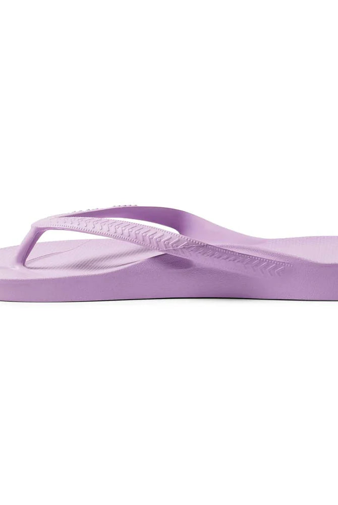 Lilac arch support thongs with contoured footbeds and ergonomic straps for enhanced comfort and stability.