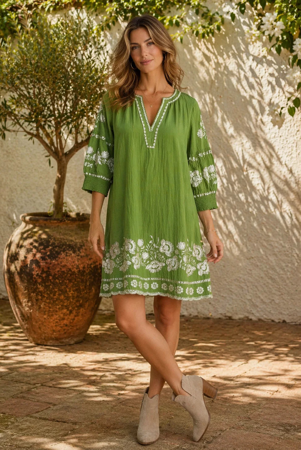 Olivine Shift Dress in 100% linen featuring floral embroidery, V-neckline, 3/4 shirred sleeves and a classic knee-length silhouette.