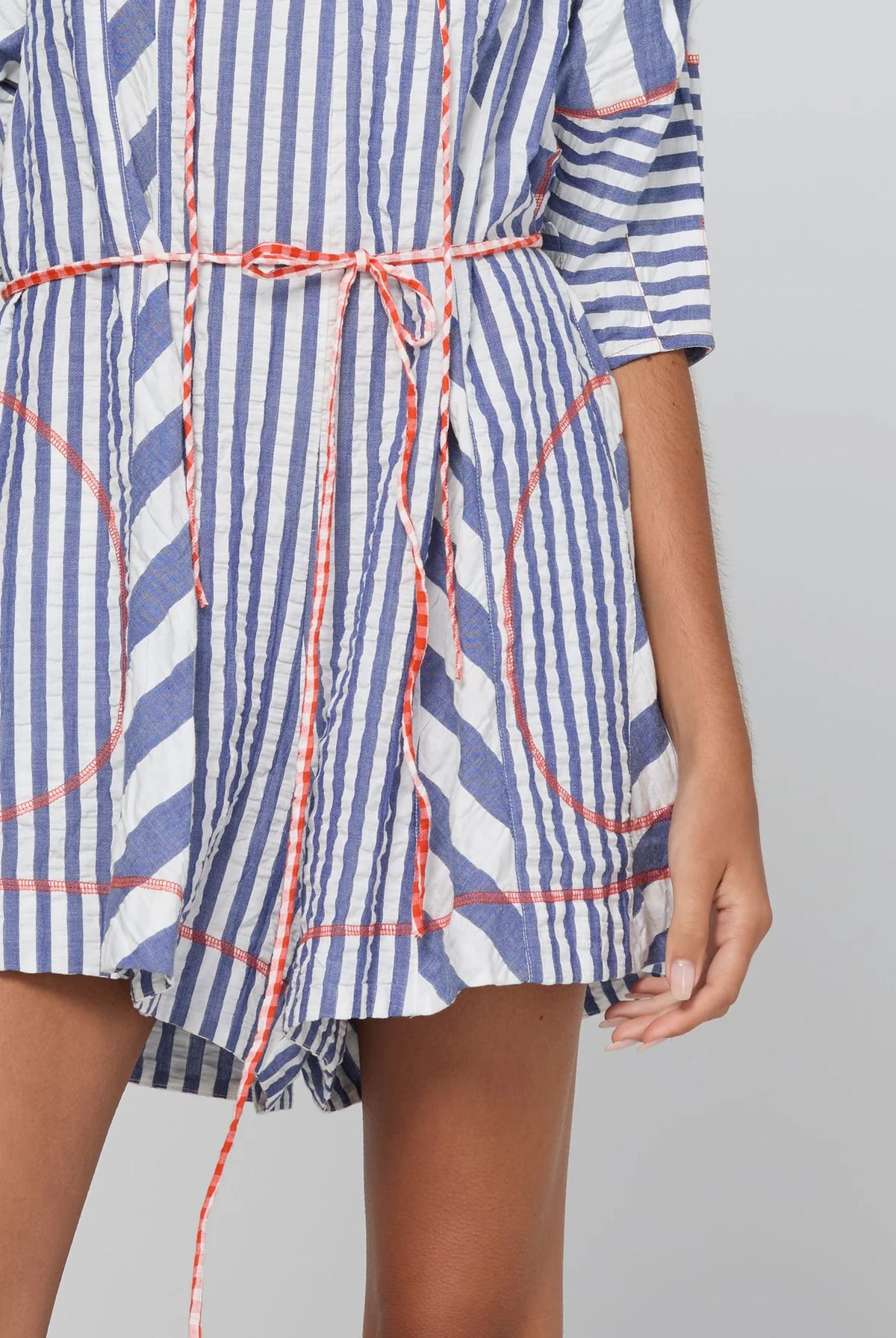 Boom Shankar Lucia Playsuit in Ocean Stripe with a tie neckline, balloon sleeves, contrast cuffs, gingham waist tie and relaxed fit.