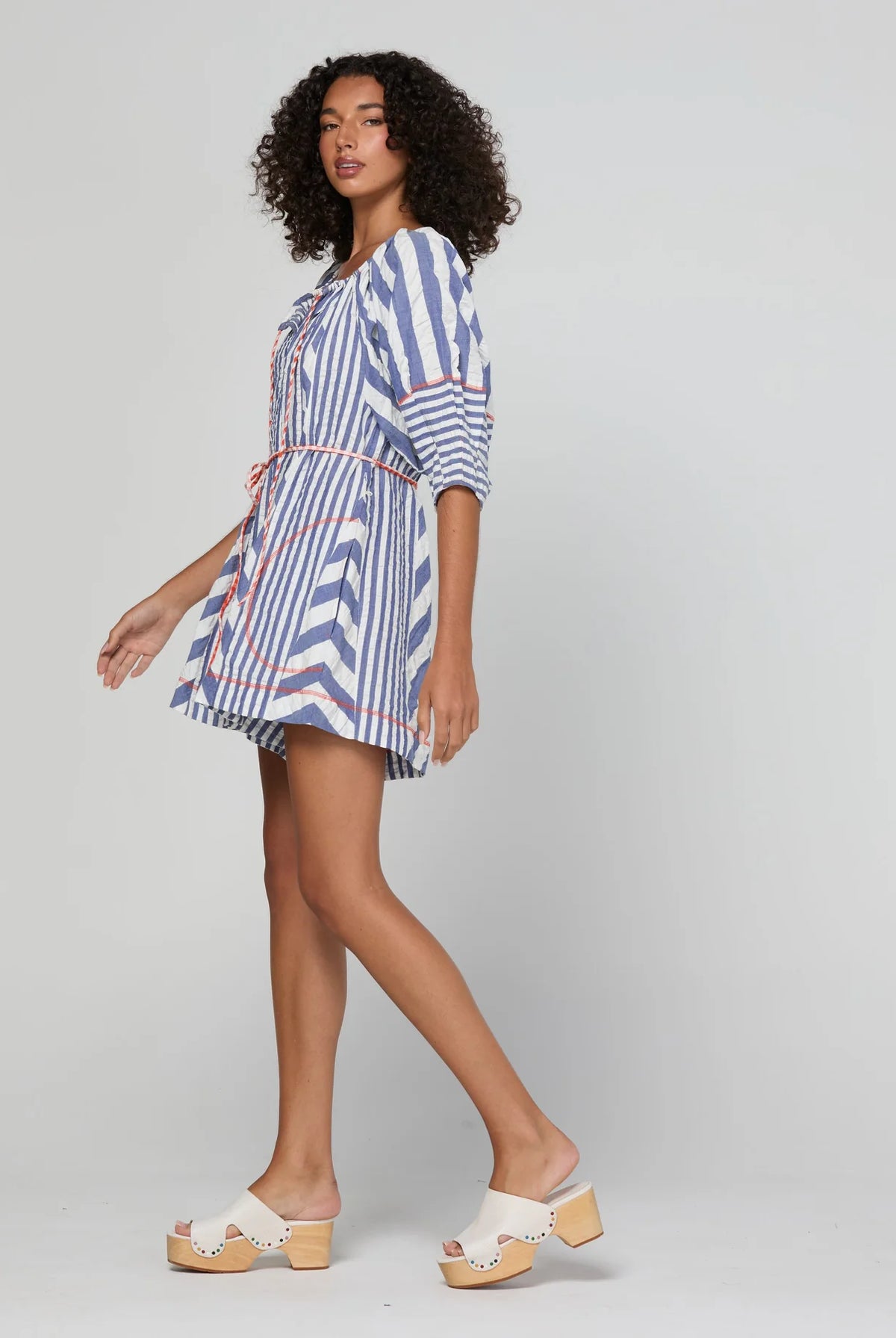 Boom Shankar Lucia Playsuit in Ocean Stripe with a tie neckline, balloon sleeves, contrast cuffs, gingham waist tie and relaxed fit.