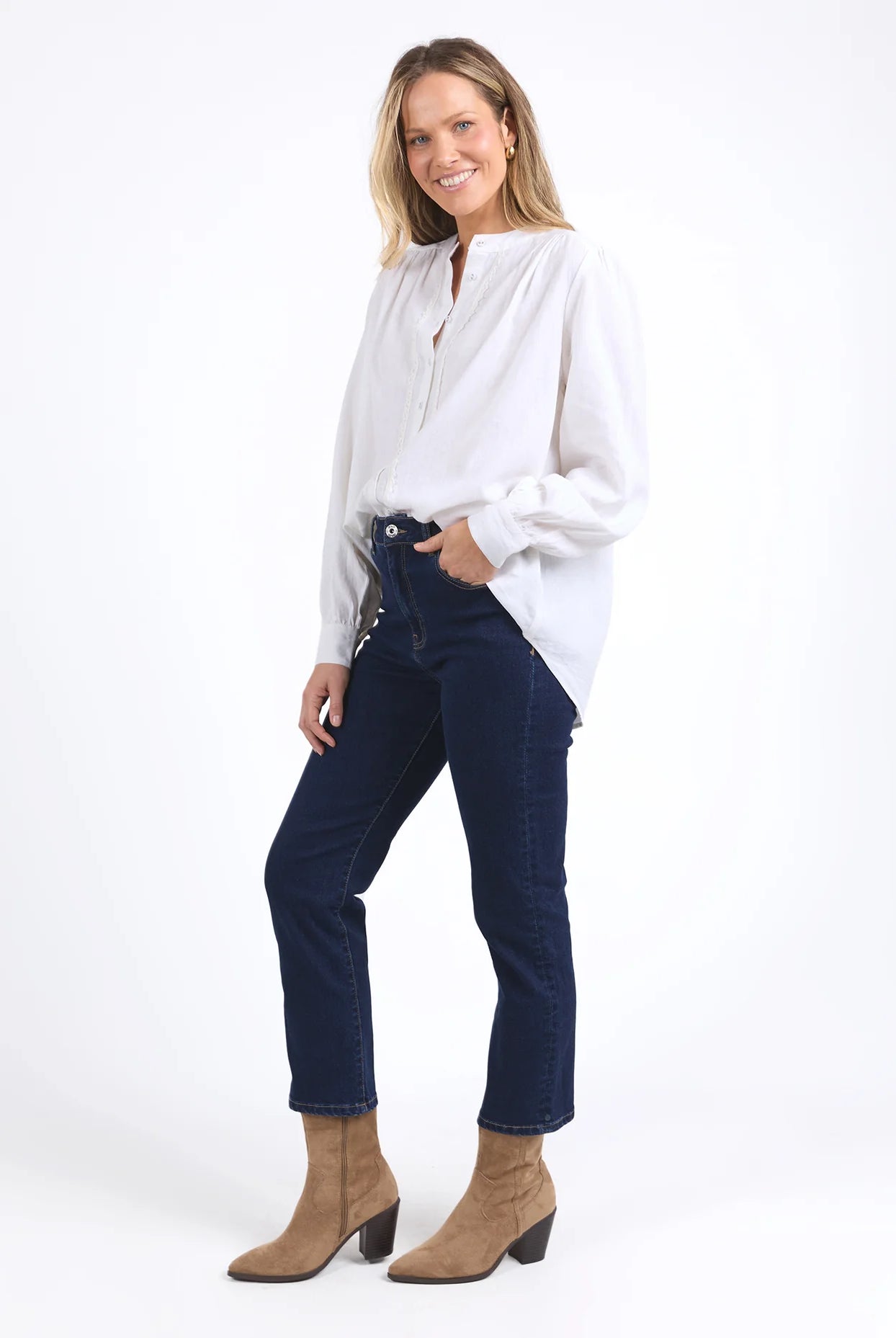 Long sleeve Marshmallow blouse with a front placket, button cuffs, and round collar, crafted from a soft linen blend for an elegant, easy-to-layer style.