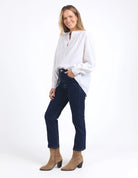 Long sleeve Marshmallow blouse with a front placket, button cuffs, and round collar, crafted from a soft linen blend for an elegant, easy-to-layer style.
