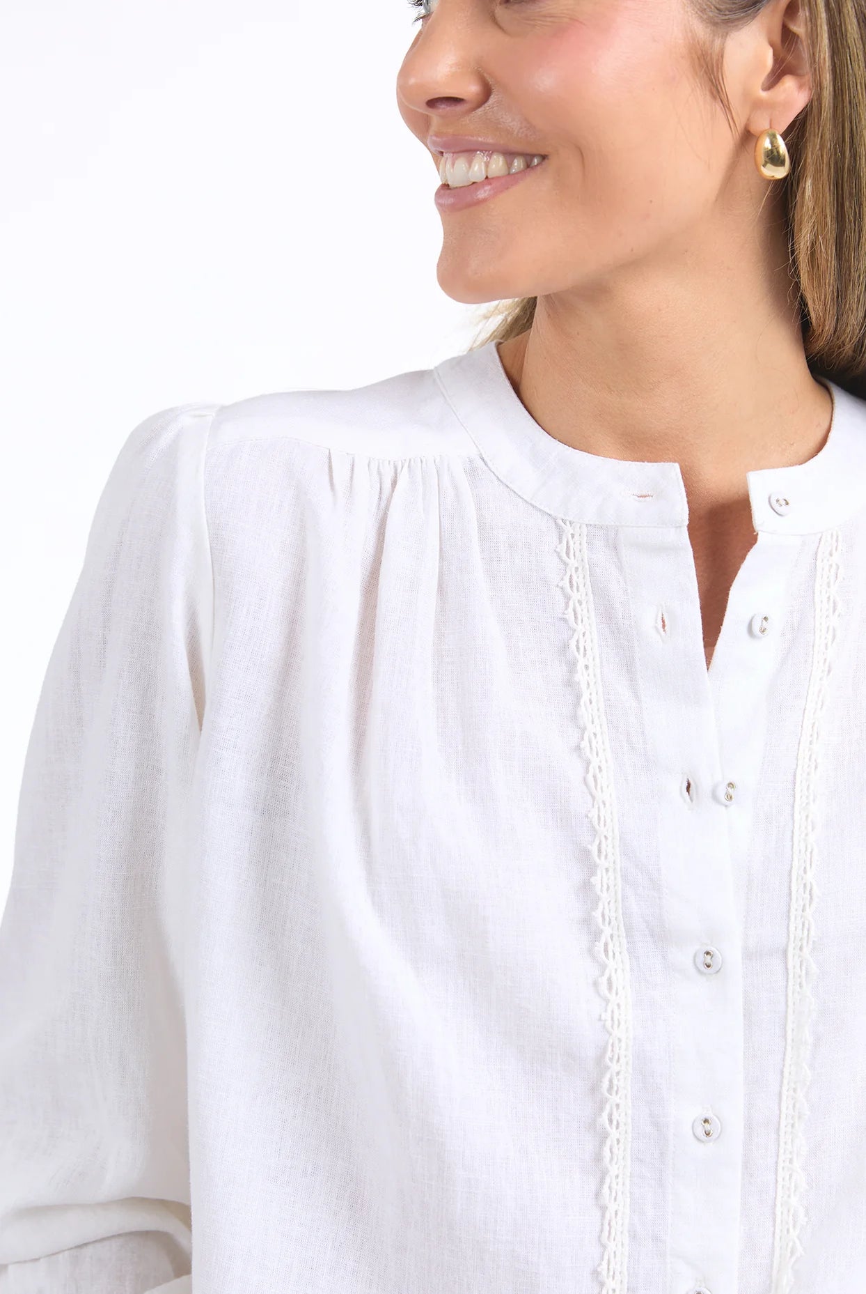 Long sleeve Marshmallow blouse with a front placket, button cuffs, and round collar, crafted from a soft linen blend for an elegant, easy-to-layer style.