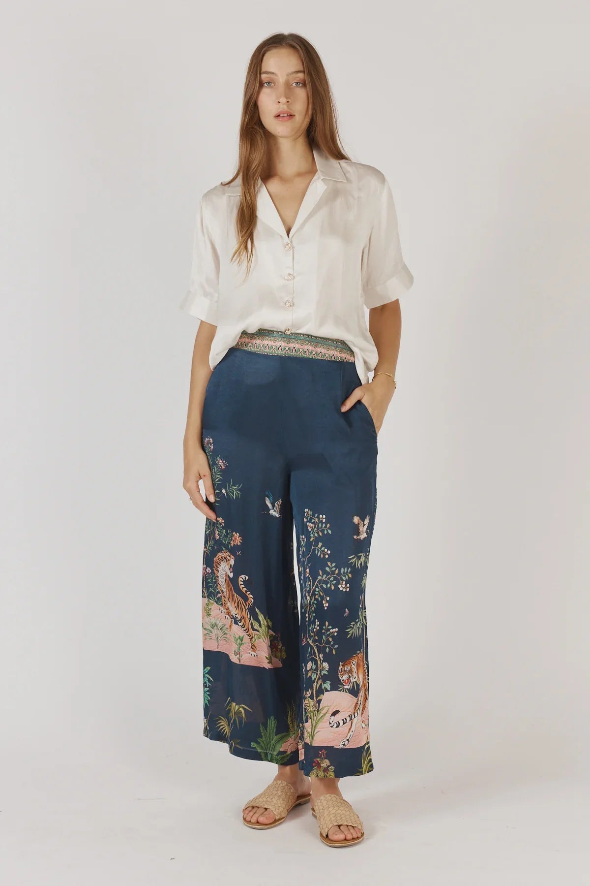 Rubyaya Machali Pant in navy with a wide-leg fit, elastic waistband, and bold tiger and floral print on lightweight viscose satin fabric.