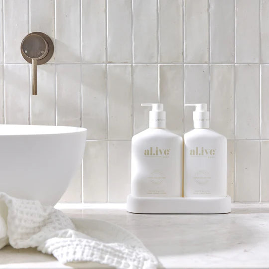 Alive Mango & Lychee Hand & Body Duo in Illuminated White featuring a 500ml hand and body wash and 500ml hand and body lotion in interlocking bottles with a matching tray.