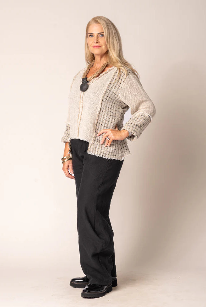 Marisol Top in Latte featuring a cropped V-neck design, asymmetrical hemline, and fringed detailing.