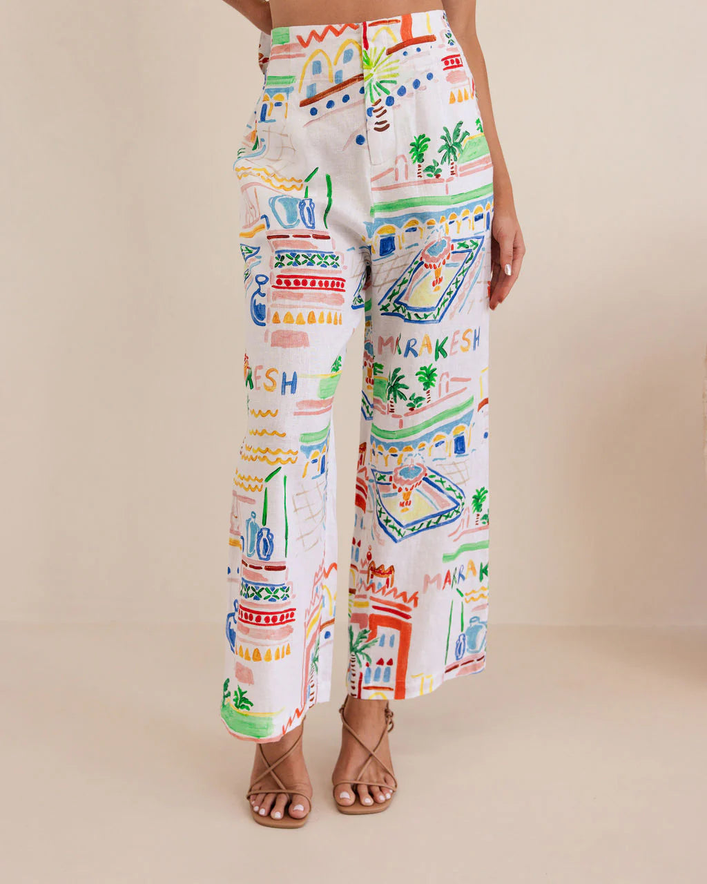 High-waisted wide-leg linen pants in vibrant Marrakesh print, featuring a breathable feel and flowing, relaxed silhouette.
