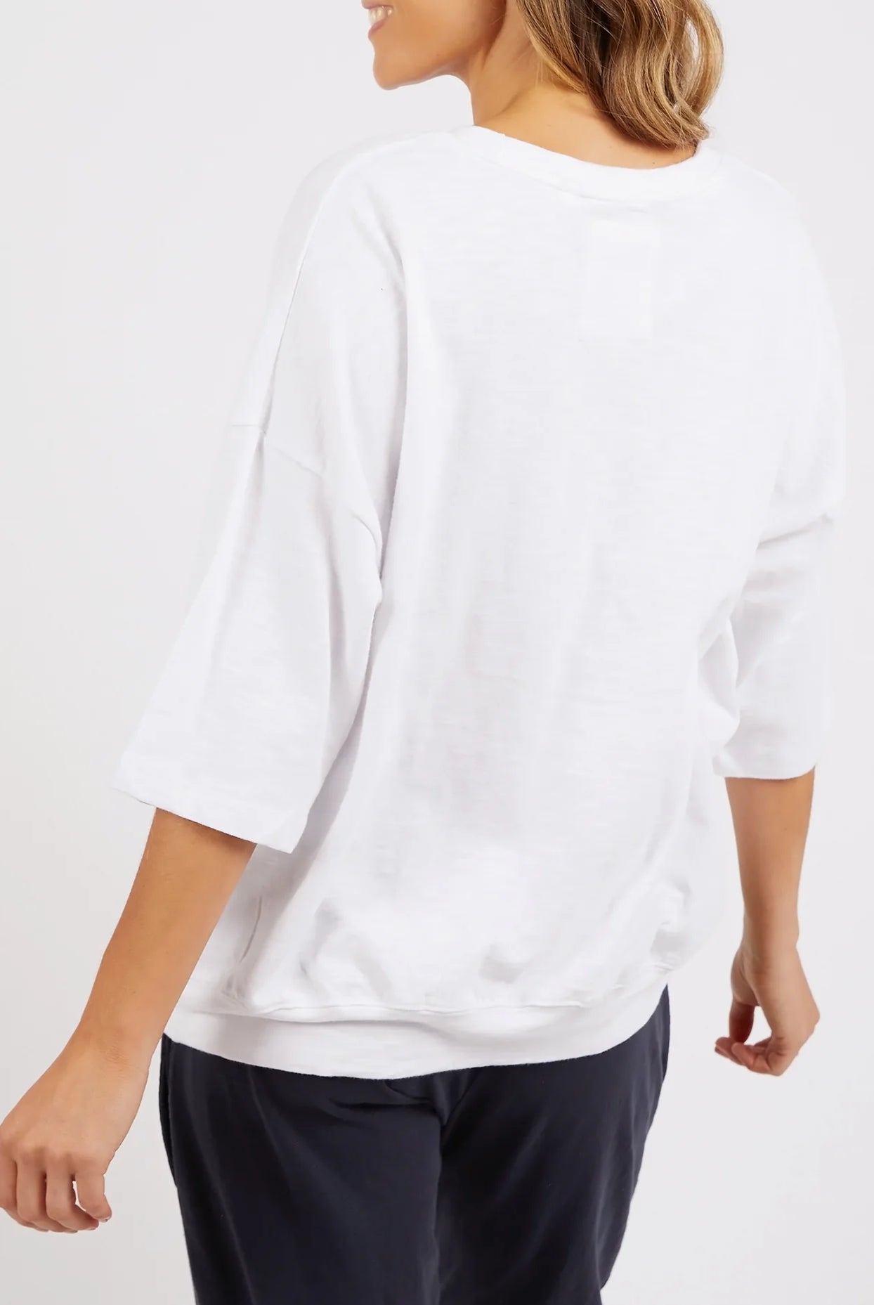 White Mazie Sweatshirt crafted from soft, cozy fabric, featuring a relaxed fit, ribbed cuffs, and a classic crew neckline for effortless comfort and style.