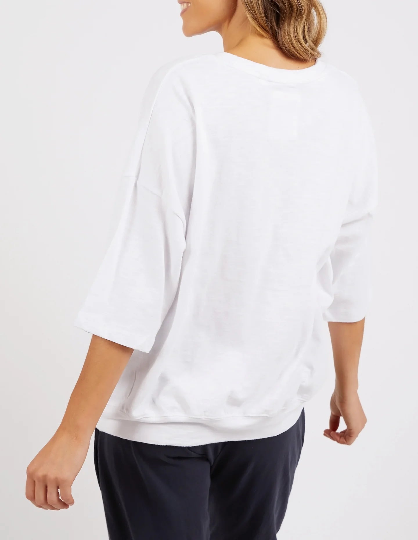 White Mazie Sweatshirt crafted from soft, cozy fabric, featuring a relaxed fit, ribbed cuffs, and a classic crew neckline for effortless comfort and style.