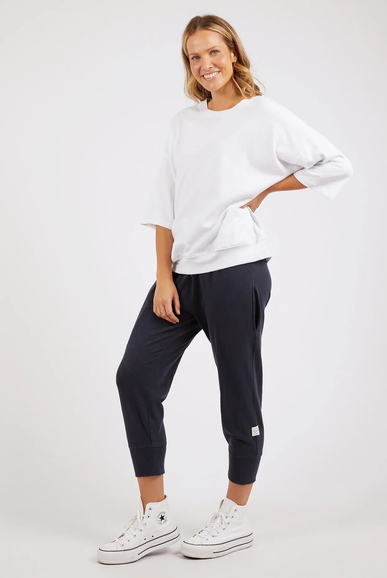 White Mazie Sweatshirt crafted from soft, cozy fabric, featuring a relaxed fit, ribbed cuffs, and a classic crew neckline for effortless comfort and style.