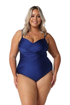 A woman modelling plus size swim wear in the Metallic Navy Criss Cross One Piece