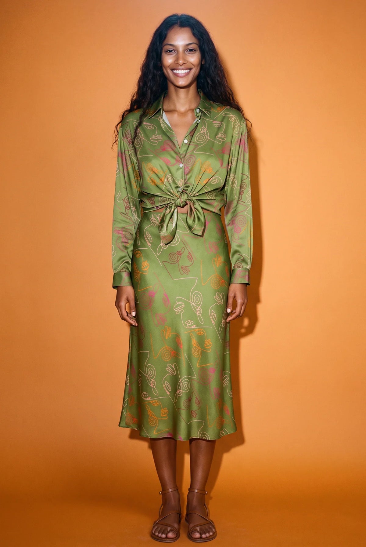 Women's Verdant Bias Midi Skirt in deep olive printed satin crepe, featuring a flattering bias cut, elegant midi length and softly flowing silhouette.