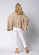 The Mireya Linen Top in Latte. Relaxed, button-up linen blouse with raw-stitched neckline, styled for warm-weather versatility.