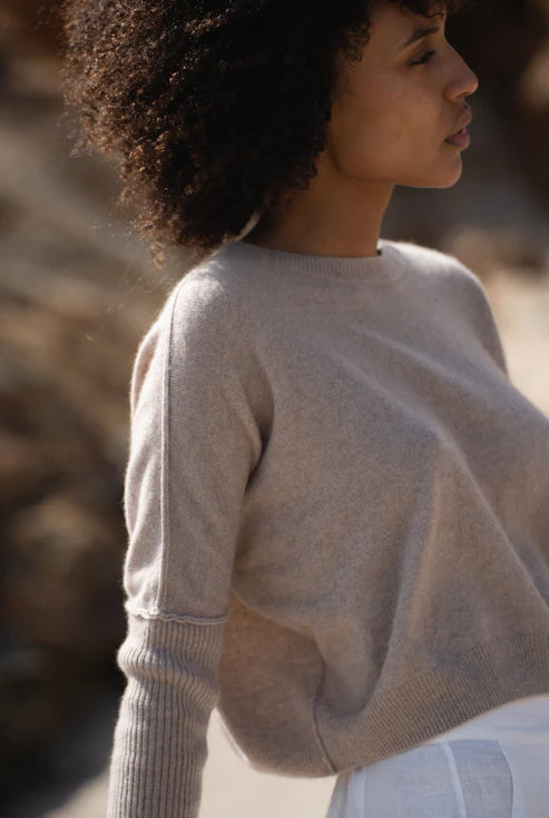 Miri Cashmere Sweater in oatmeal, lightweight and soft, with a cozy, minimalist look.