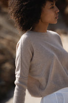Miri Cashmere Sweater in oatmeal, lightweight and soft, with a cozy, minimalist look.