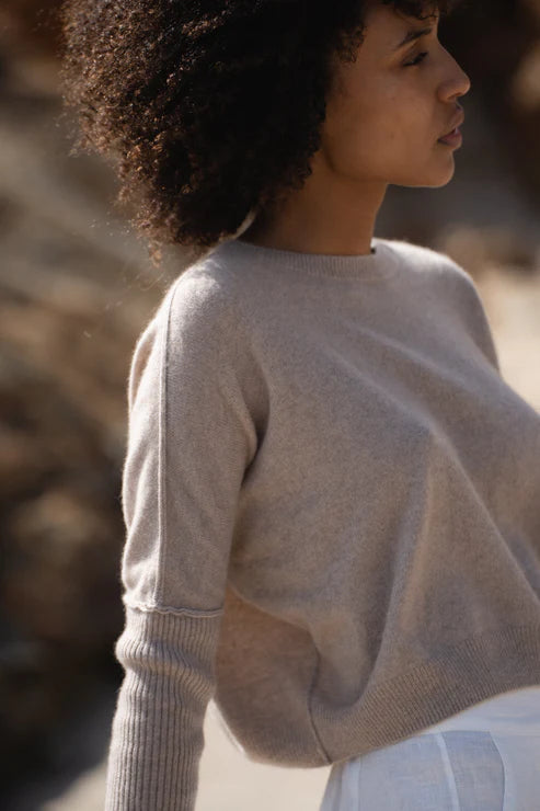 Miri Cashmere Sweater in oatmeal, lightweight and soft, with a cozy, minimalist look.