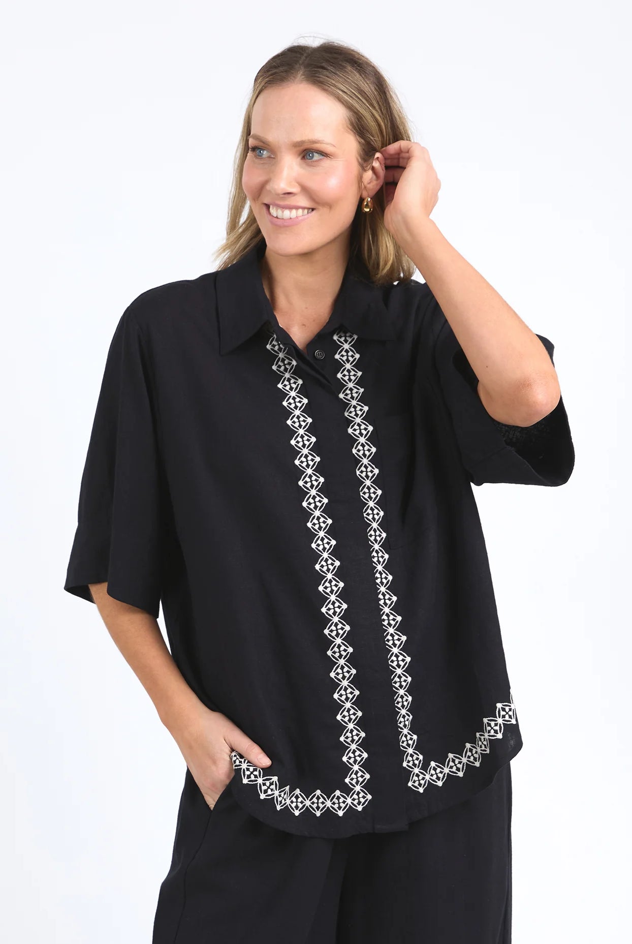 Nina Embroidered Shirt in Black featuring delicate embroidery on the front placket and hemline, made from a soft linen-viscose blend with an oversized fit.