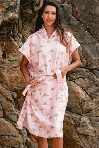 The Palm Surf Poncho is a sand-free, super-absorbent, quick-drying hooded towel. Lightweight, antibacterial, and soft, with a pocket and optional waist tie.