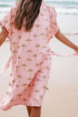 The Palm Surf Poncho is a sand-free, super-absorbent, quick-drying hooded towel. Lightweight, antibacterial, and soft, with a pocket and optional waist tie.