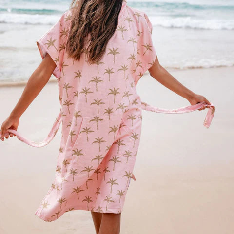 The Palm Surf Poncho is a sand-free, super-absorbent, quick-drying hooded towel. Lightweight, antibacterial, and soft, with a pocket and optional waist tie.