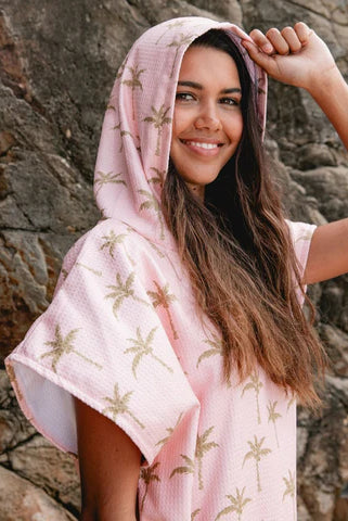 The Palm Surf Poncho is a sand-free, super-absorbent, quick-drying hooded towel. Lightweight, antibacterial, and soft, with a pocket and optional waist tie.
