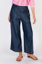 Wide-leg denim palazzo pants with a flat front waistband, elasticated back, and side pockets, offering a relaxed and stylish fit.
