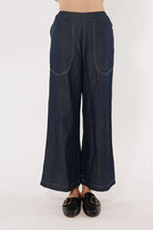 Wide-leg denim palazzo pants with a flat front waistband, elasticated back, and side pockets, offering a relaxed and stylish fit.