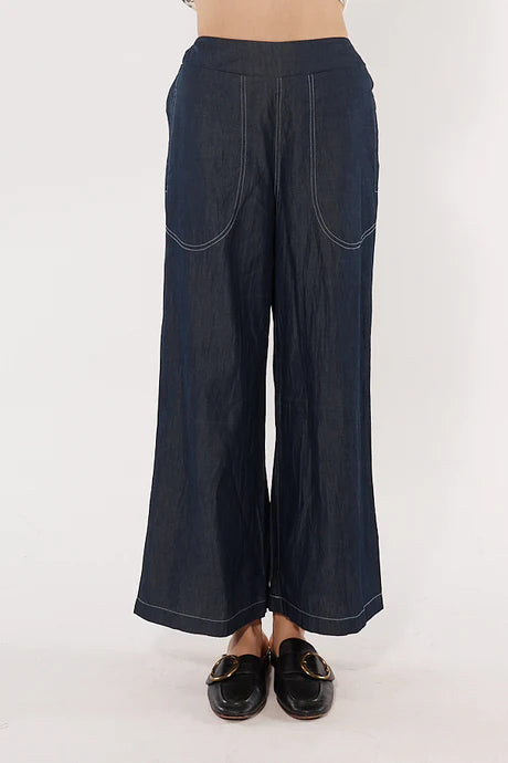 Wide-leg denim palazzo pants with a flat front waistband, elasticated back, and side pockets, offering a relaxed and stylish fit.