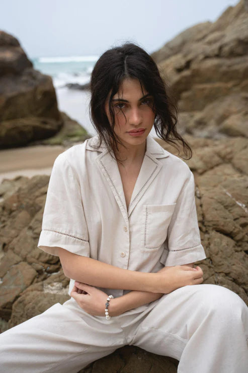 Quinn Linen Shirt in Chalk, featuring a relaxed, boxy fit, cotton lace inserts on the pocket, collar, and cuffs, and finished with French seams for a polished look.