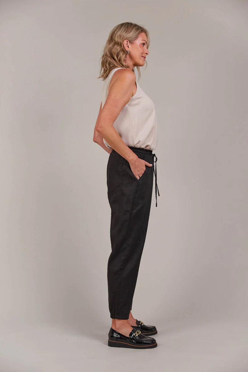 Relaxed-fit pant with an elastic waist, adjustable drawstring, and tapered ankle-length cut, made from a breathable linen-cotton blend for effortless style.