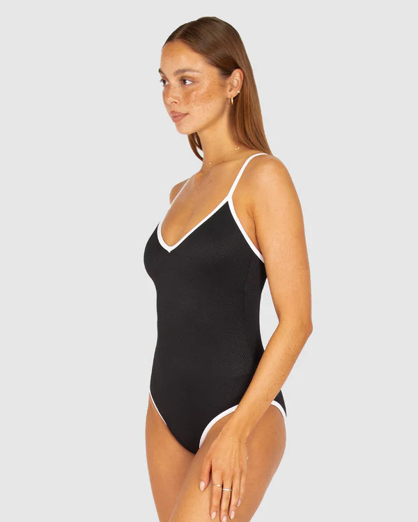A sleek and sophisticated one-piece swimsuit in buttery-soft Rococco fabric, featuring a flattering V-neckline and structured shaping for a confident, elegant fit.