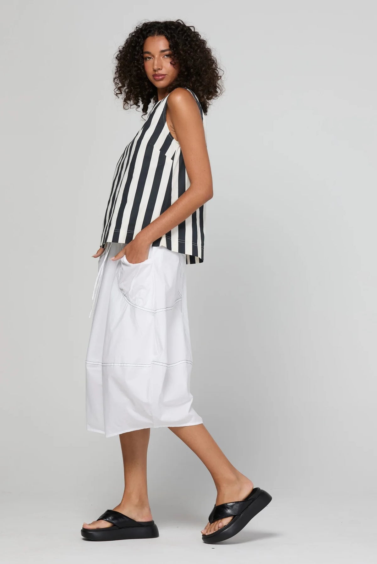 Shiro Top in Mono Stripe featuring a sleeveless design, relaxed A-line fit, round neckline and back keyhole detail.