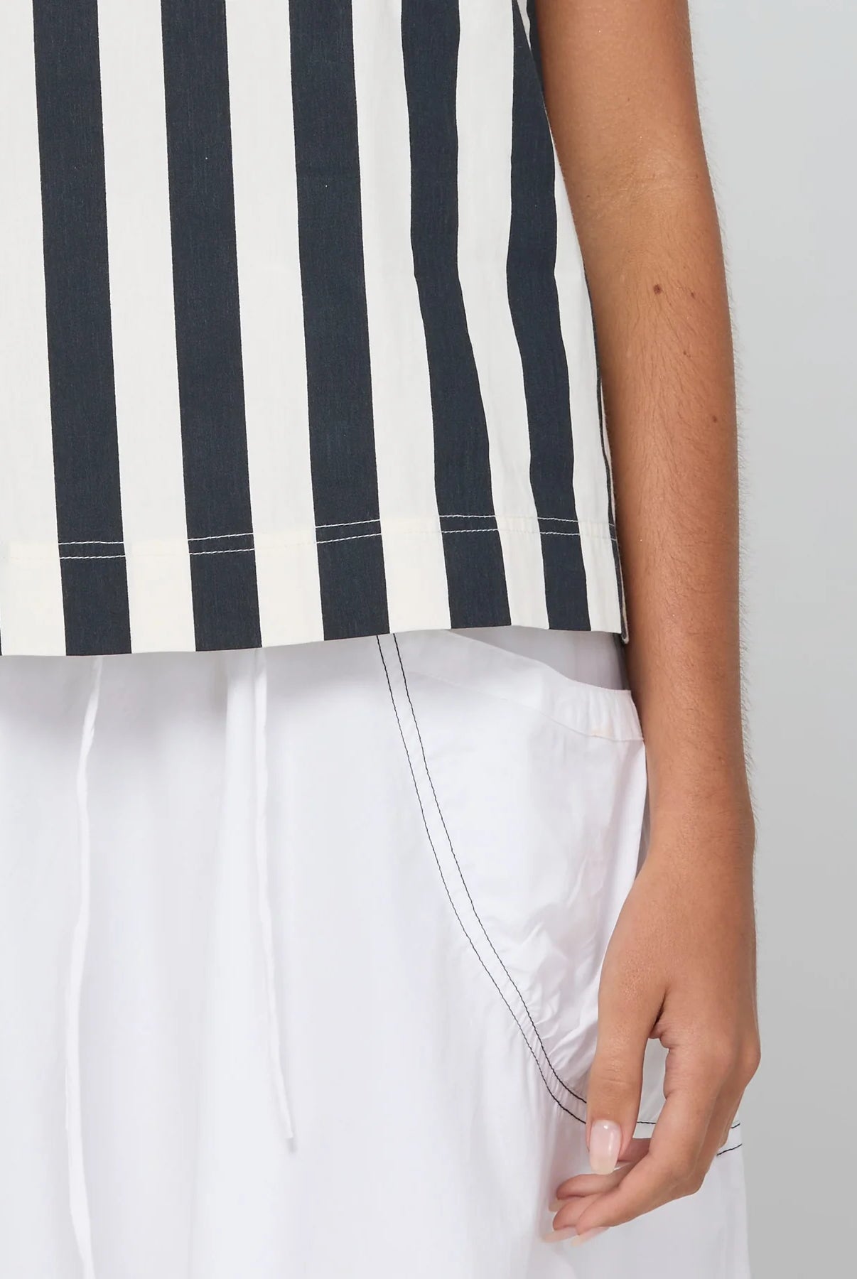 Shiro Top in Mono Stripe featuring a sleeveless design, relaxed A-line fit, round neckline and back keyhole detail.