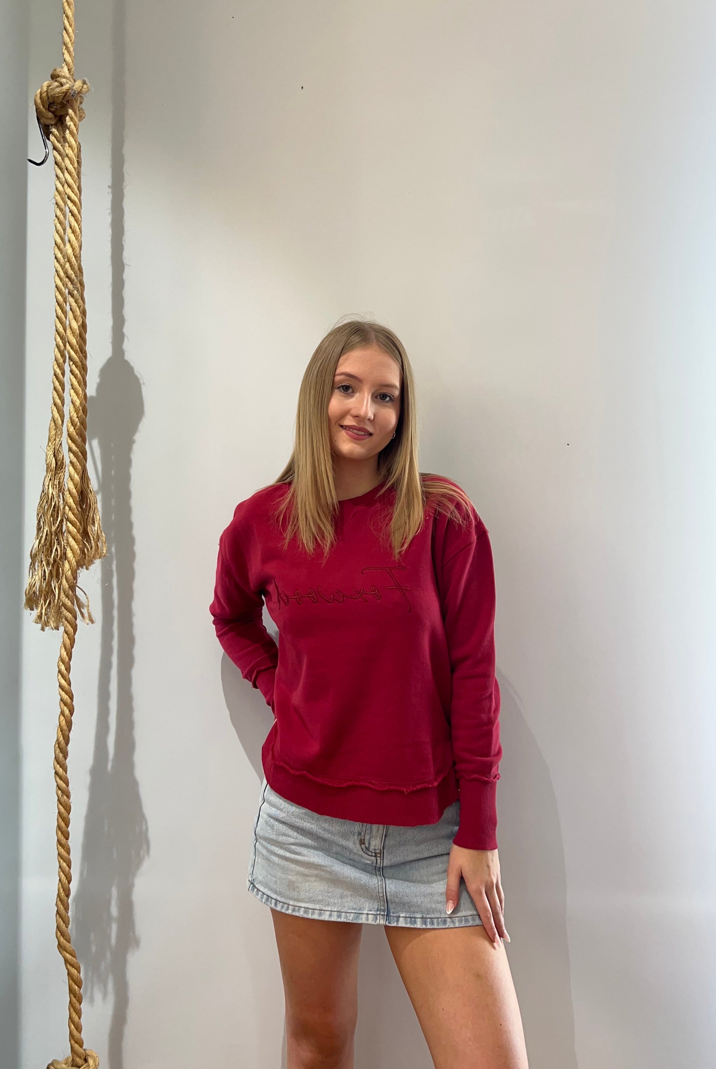 Foxwood Signature Crew in Rhubarb Red featuring front chest embroidery, raw edge detailing, a curved hem and soft 100% cotton fabric.